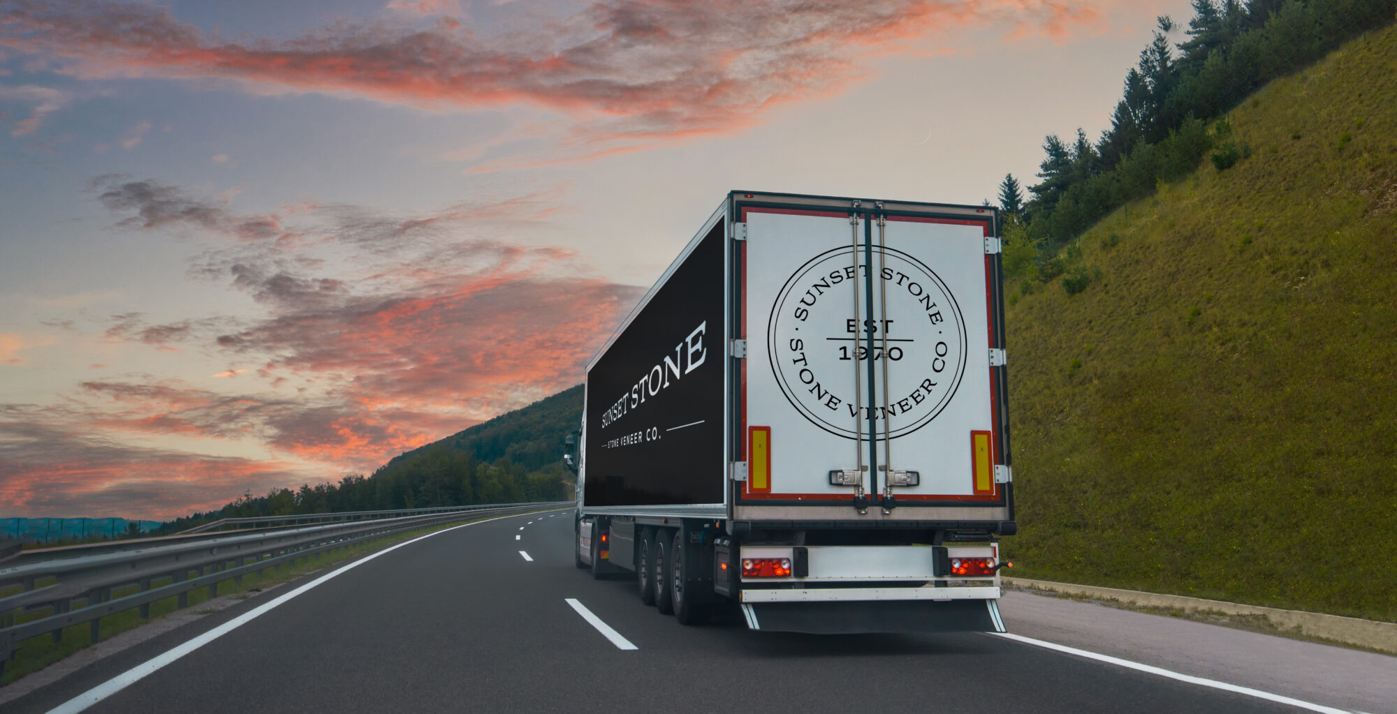 sunset stone semi truck driving down road