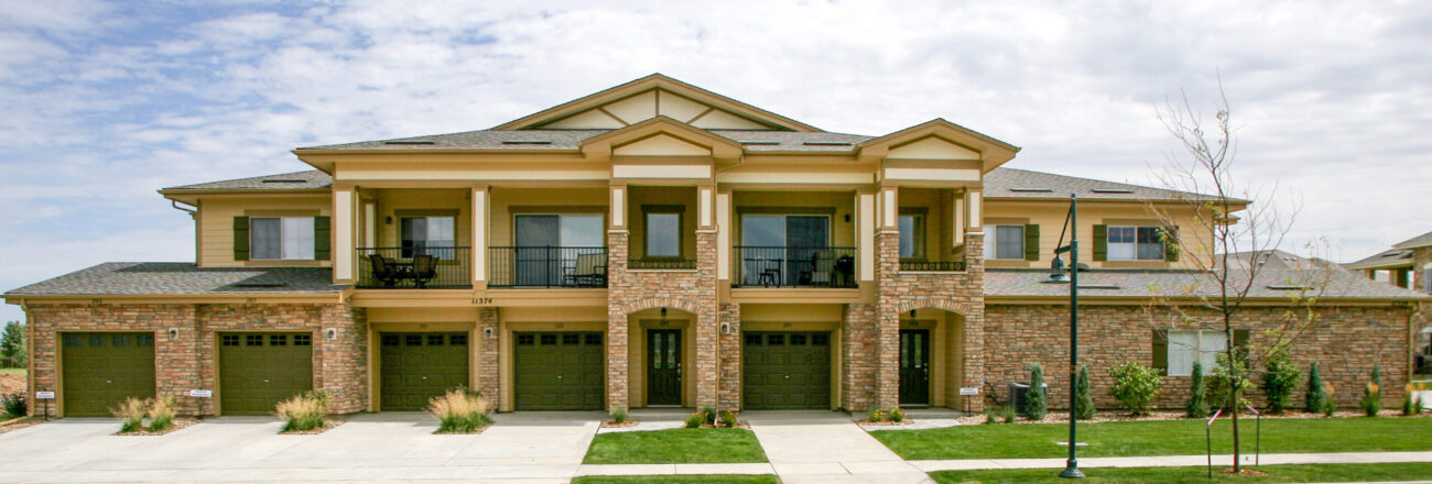 condominium with ledge stone veneer