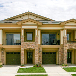 condominium with ledge stone veneer
