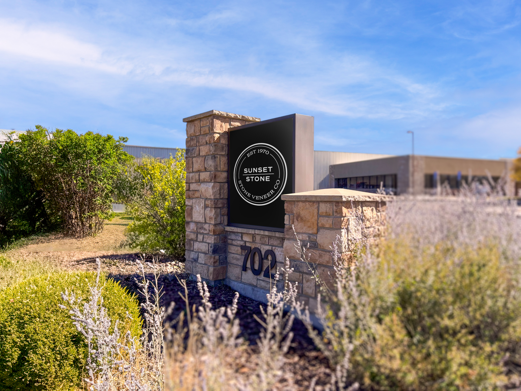 sunset stone logo signage at headquarters
