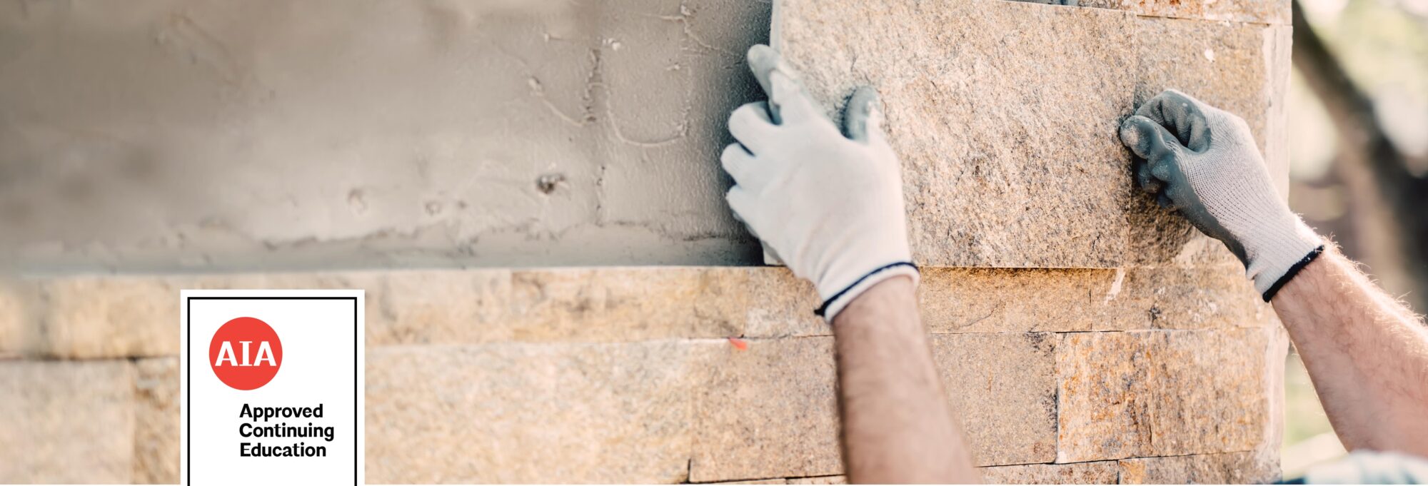 AIA Approved Continuing Education Image with worker placing stone on wall